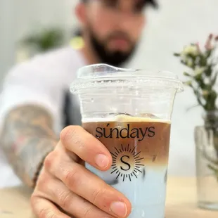 a man holding a cup of coffee