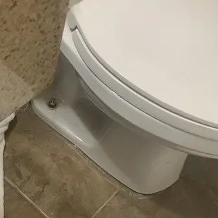 Wobbly toilet... bolt needs to be tightened and toilet needs to be caulked around the bottom