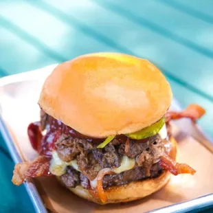 a beef sandwich on a tray