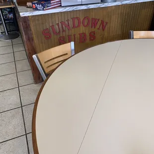 a table and chairs in a restaurant