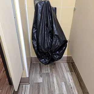 A urinal in the men's restroom covered for no use
