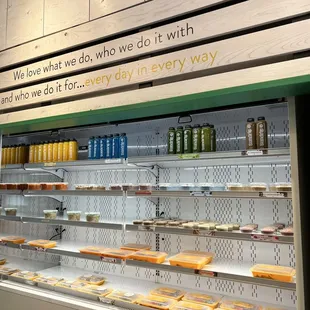 a display case with a variety of food items