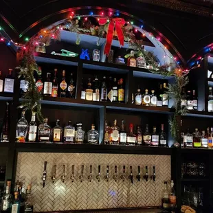 a bar filled with bottles of alcohol