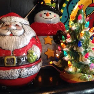 painted Santa, snowman, lighted Christmas tree