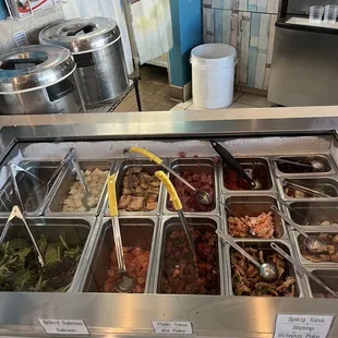 1/2 of the toppings offered including the raw and cooked meat options.