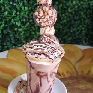 a chocolate sundae topped with nuts