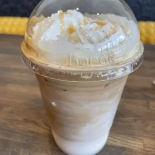 Iced vanilla latte with whipped cream