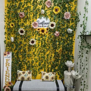 a bench with sunflowers on it