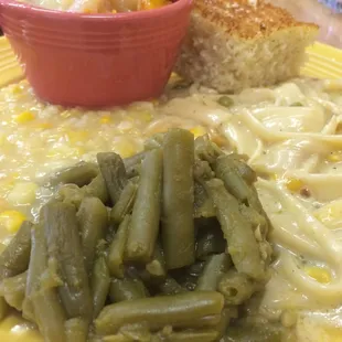 Chicken spaghetti, corn and beans with peach cobbler. A+