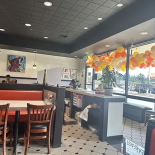 View from inside the restaurant, the front entrance with balloons following their grand opening earlier.