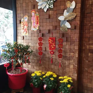 Getting ready for Lunar New Year with wall decorations.
