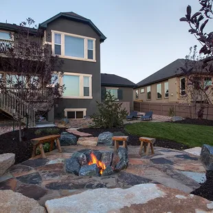 Flagstone patio, wood burning fire pit and custom designed landscaping