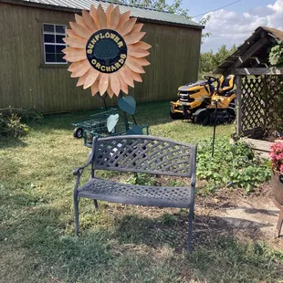 a bench and a tractor in the background