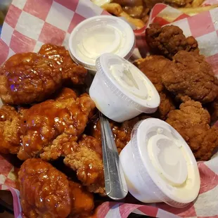 a basket of fried chicken and fries