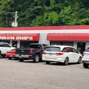 a row of cars parked in a parking lot