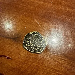 The bar had shipwreck coins and hooks under the laminate... Nice nautical theme
