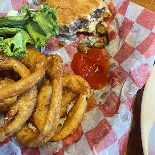 Mushroom and Swiss burger with onion rings
