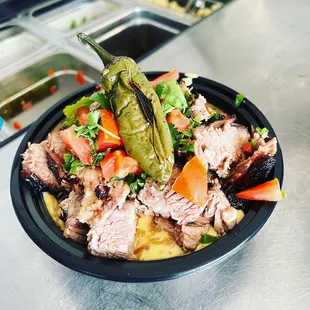 Our brisket topped loaded green chili mashed potatoes!