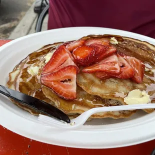 Pancakes; strawberries extra charge.