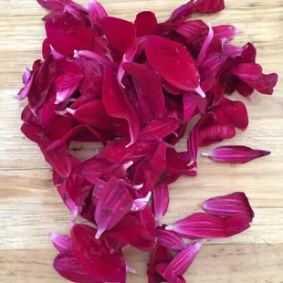This pile of petals fell off the 7 stems of dahlias I purchased. Hard to tell, but this is at least 200 petals. 8/31/15