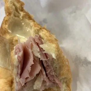 Awesome ham and cheese croissant with oozing cheese and a lot of ham.