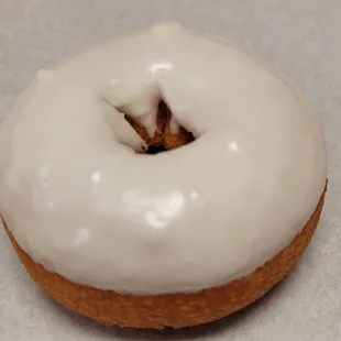 a glazed donut with white icing
