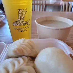 a cup of coffee and a plate of dumplings