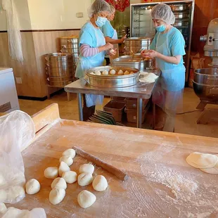 two women preparing dumplings