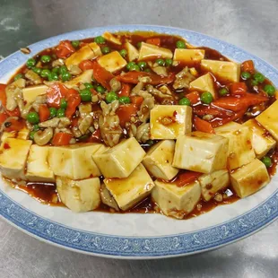a plate of tofu and vegetables