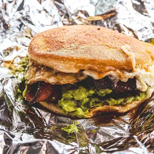 a sandwich wrapped in tin foil