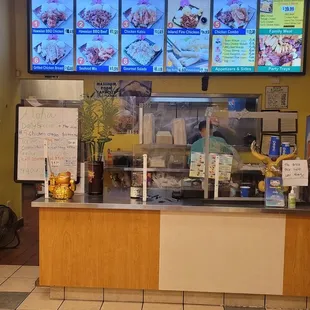 a restaurant counter and menus
