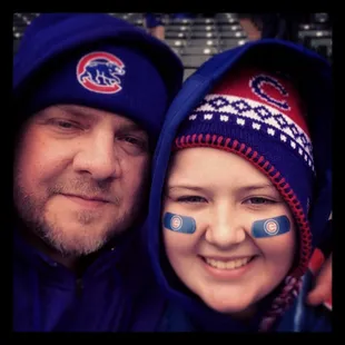 a man and a woman with painted faces