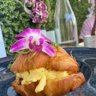 Croissant with egg bacon and cheddar