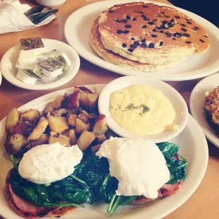 Eggs Benedict with spinach. Chocolate chip pancakes