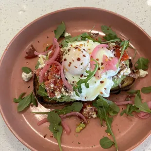 Avocado Toast | Campari Tomato, Feta, Chopped Bacon, Chili Flakes, Poached Egg, Grilled Bread