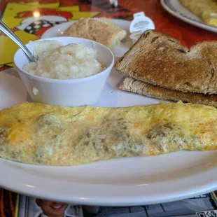 Chorizo and cheese omelette with rasin toast and grits