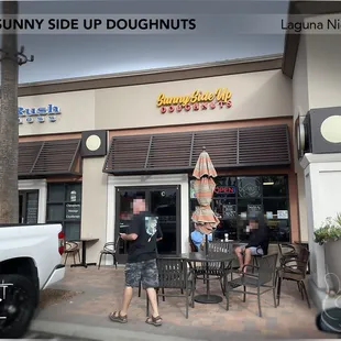 Shop front w/outdoor seating.