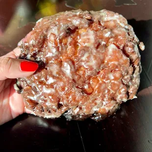Apple Fritter. Starts of crunchy with a burst of cinnamon apple folded within a moist and doughy interior of the fritter.