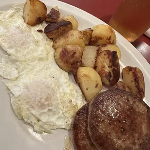 Sausage Patty breakfast with 2 eggs over medium and home fried potatoes
