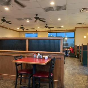 a restaurant with booths and tables