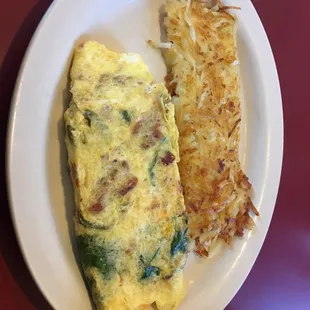 Spinach, bacon, jalapeño and american cheese omelette.  Totally tasty.