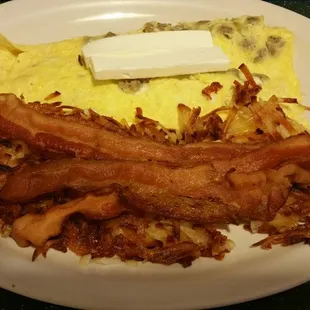 Sausage, cream cheese, avocado omelet, hash browns, and side of bacon. Mmm