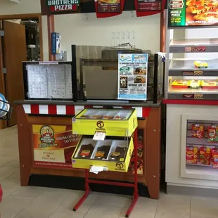 Right by the register is where pizza is sold.