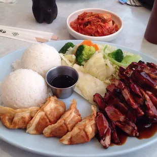 Chicken teriyaki and gyoza, with a side of kimchi