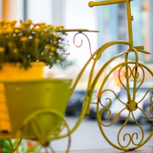 a bicycle with a basket of flowers