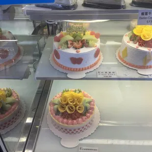 a variety of cakes on display