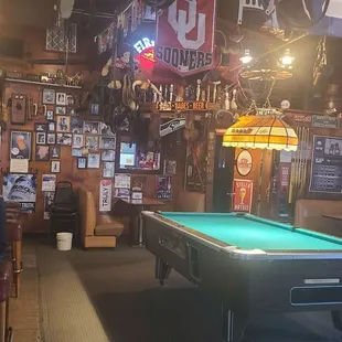 a pool table in the middle of the room