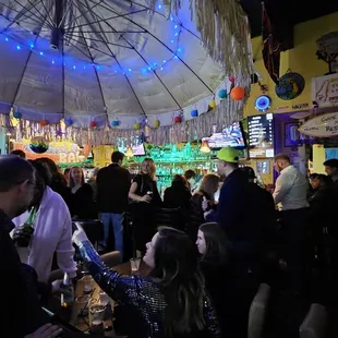 a crowd of people at a bar