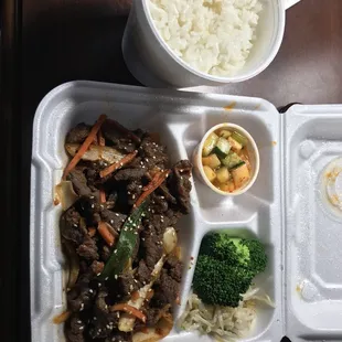 a meal in a styrofoam container
