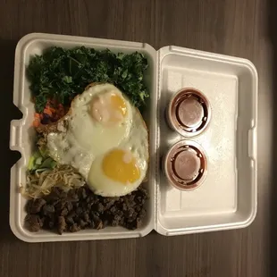 a meal in a styrofoam container
